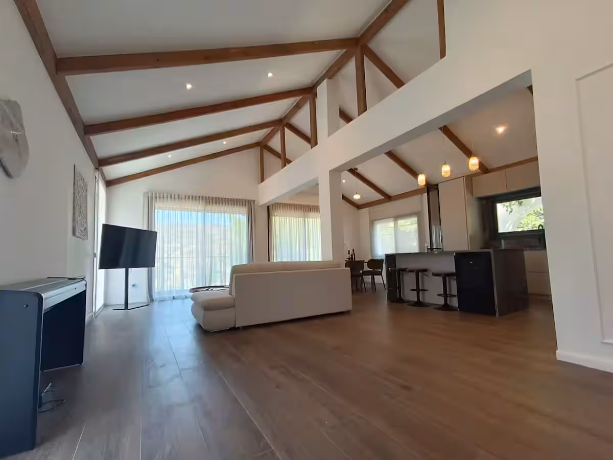 Wide view of the vaulted living space